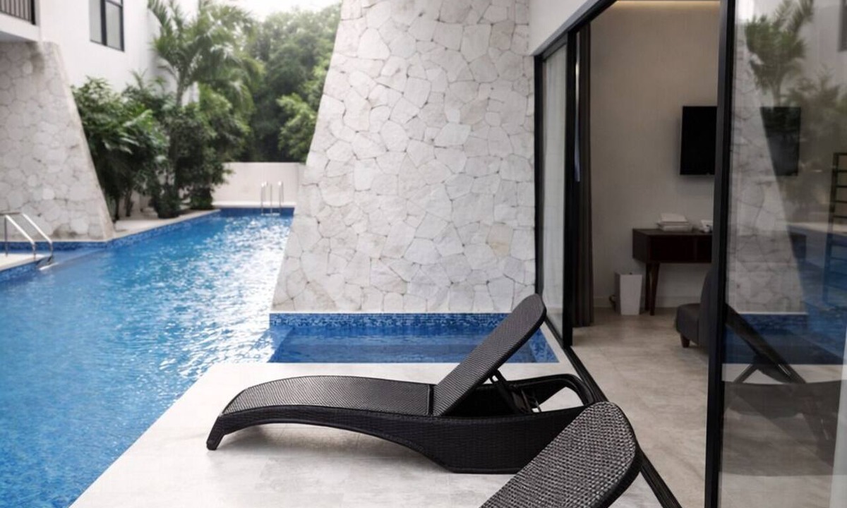 Tulum Condo | Escape to Giada Towers, Aldea Zama: 2-bedroom, 2-bathroom apartment with a private jacuzzi on the main terrace and a large L-shaped terrace with a grill and direct access to the pool. Includes 2 bicycles and access to the gym, movie theater, and ck