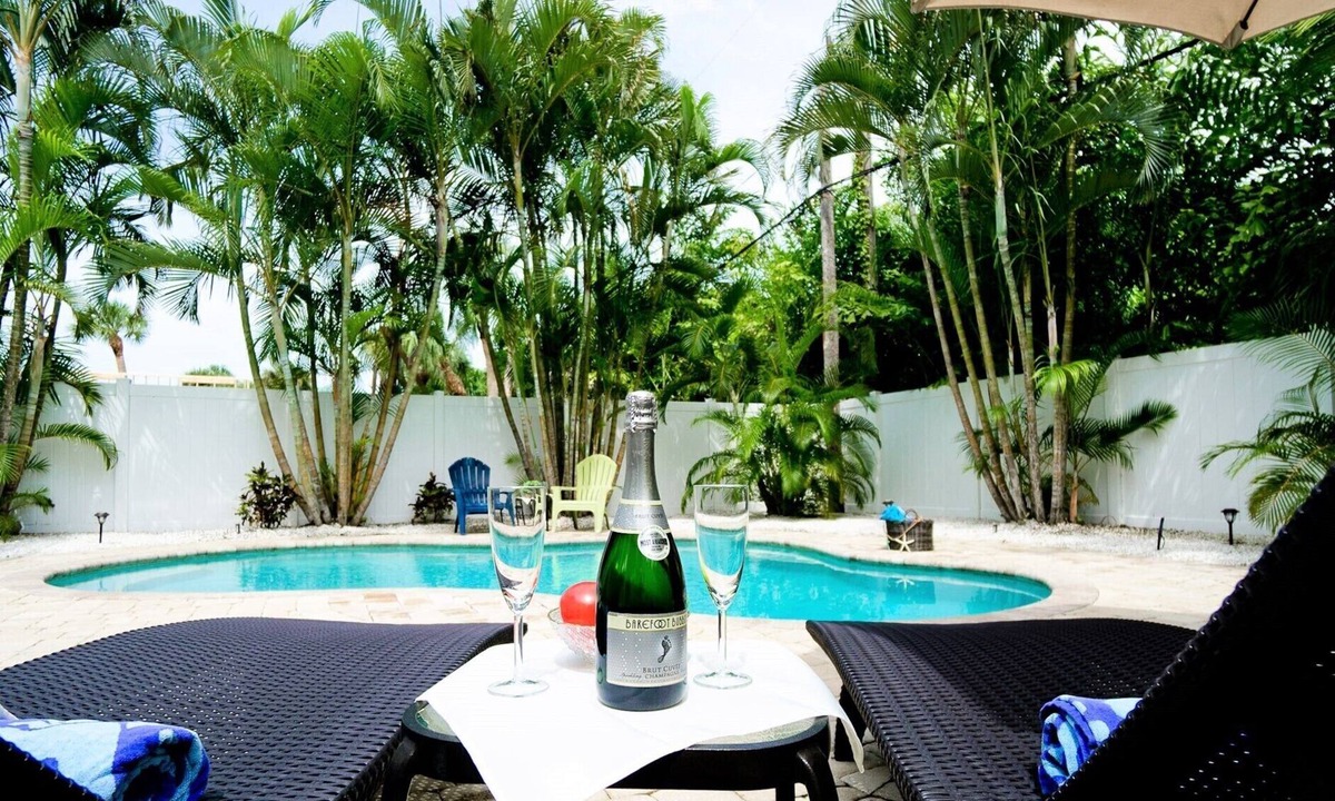 Holmes Beach House | Tropical Poolside Living Steps from AMI Beaches