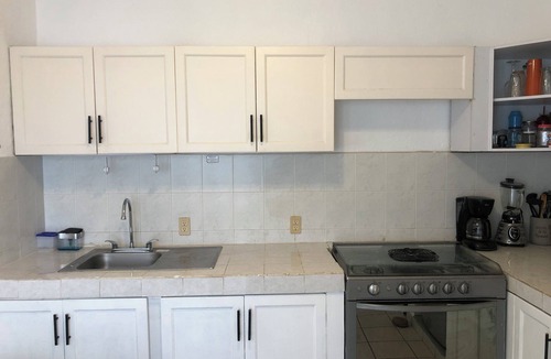 Las Glorias Apartment | 3 min walk to beach, seasonal/long term ok, cats ok, quiet, a/c, large pool
