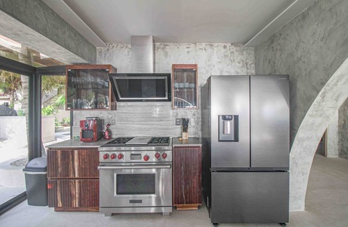 Soliman Bay House | Beachfront home with private heated pool, jacuzzi, sauna, ocean views & AC