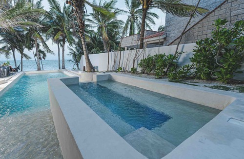 Soliman Bay House | Beachfront home with private heated pool, jacuzzi, sauna, ocean views & AC