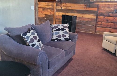 Clovis Apartment | Covered parking with fire pit