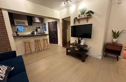 San Antonio del Mar Apartment | Cozy studio 3 blocks from the beach in San Antonio del Mar. Enjoy a private rooftop terrace with our signature galactic whale mural, community pools & tennis courts, and a secure 24/7 gated community. Perfect for couples or small groups.