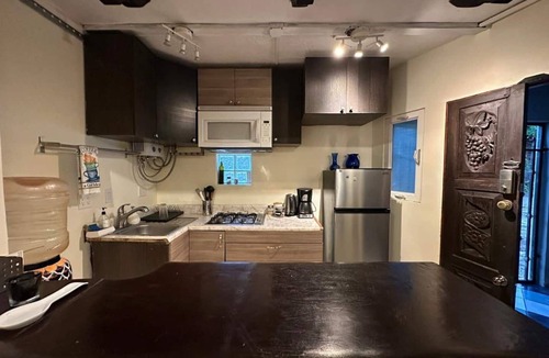 San Antonio del Mar Apartment | Cozy studio 3 blocks from the beach in San Antonio del Mar. Enjoy a private rooftop terrace with our signature galactic whale mural, community pools & tennis courts, and a secure 24/7 gated community. Perfect for couples or small groups.