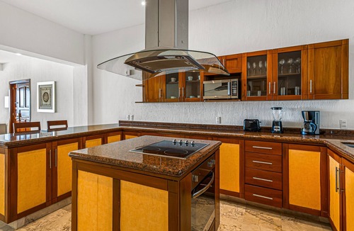 Conchas Chinas Apartment | Elegant oceanview suite with heated pool, private hot tub & terrace dining