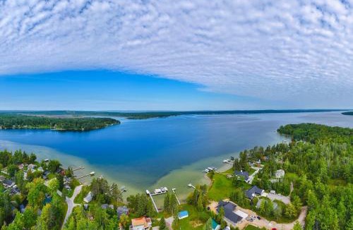 Indian River House | Fall Hikes & Fire Pit: Pet-Friendly MI Retreat