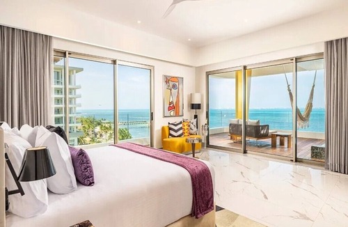 Puerto Juarez Condo | Mousai Studio-Indulge in modern adults-only elegance at the exclusive Cancun.