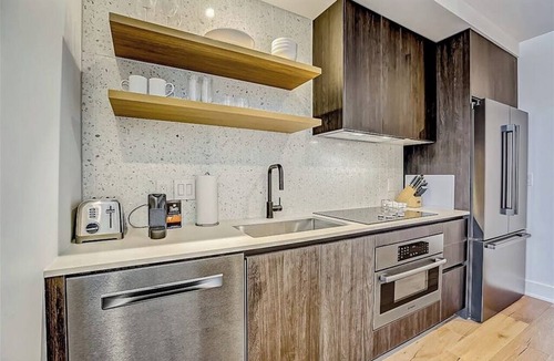 Rainey Street Historic District Apartment | Natiivo Austin studio - lake & skyline-view balcony, pool & gym - dogs OK