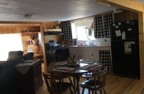 North New Portland Cottage | Paddle, float, fish, or rope swing into the lake. Direct ATV trail access too!