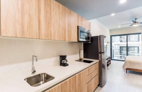 Zazil-ha Condo | Rooftop Pool and Ocean Views in Modern Studio Near Beach