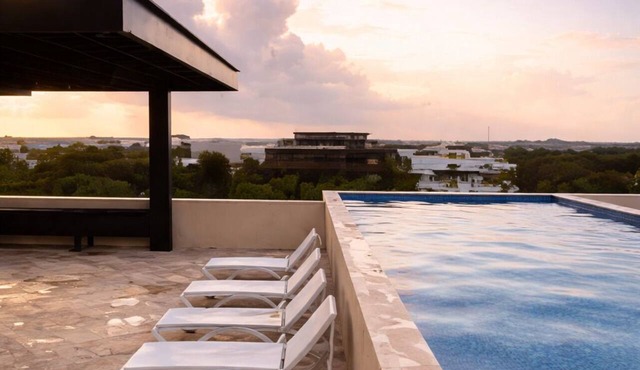 Escape to Giada Towers, Aldea Zama: 2-bedroom, 2-bathroom apartment with a private jacuzzi on the main terrace and a large L-shaped terrace with a grill and direct access to the pool. Includes 2 bicycles and access to the gym, movie theater, and ck in Tulum