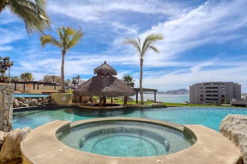 Stylish Coastal Retreat with Breathtaking Views, Resort Pool & Private Balcony in Cabo San Lucas